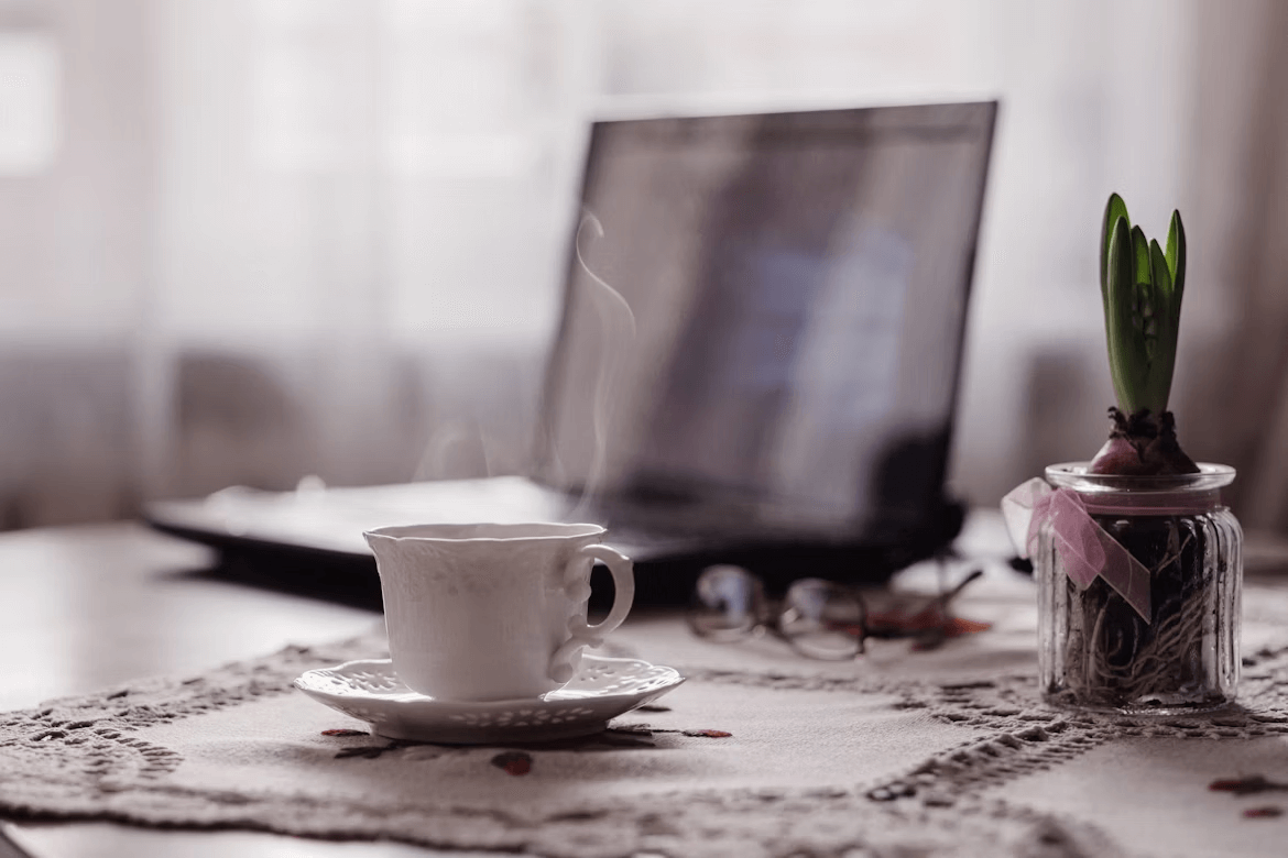 Calm workspace — tea and laptop